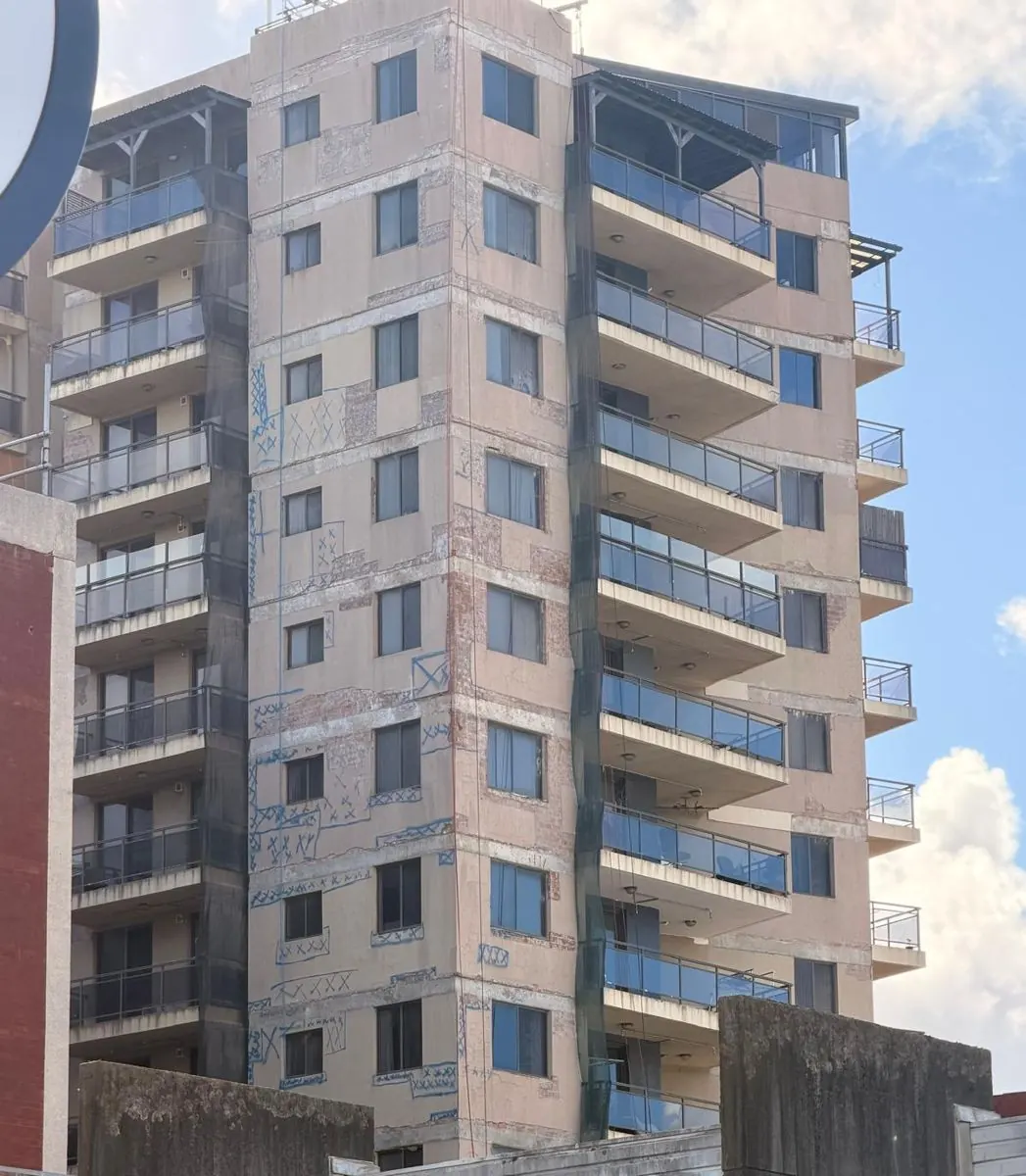 Strata high-rise in Bankstown with concrete defects mapped across the façade before rope access repairs