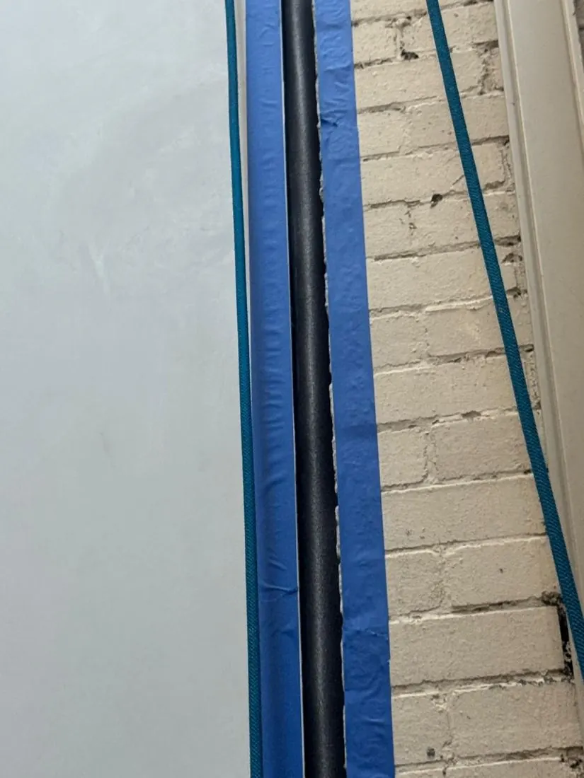New sealant in a vertical joint between render and brick